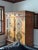 A hand painted, hand carved, Indonesian armoire made of teak. Carved throughout with a diamond motif, decorated with...
