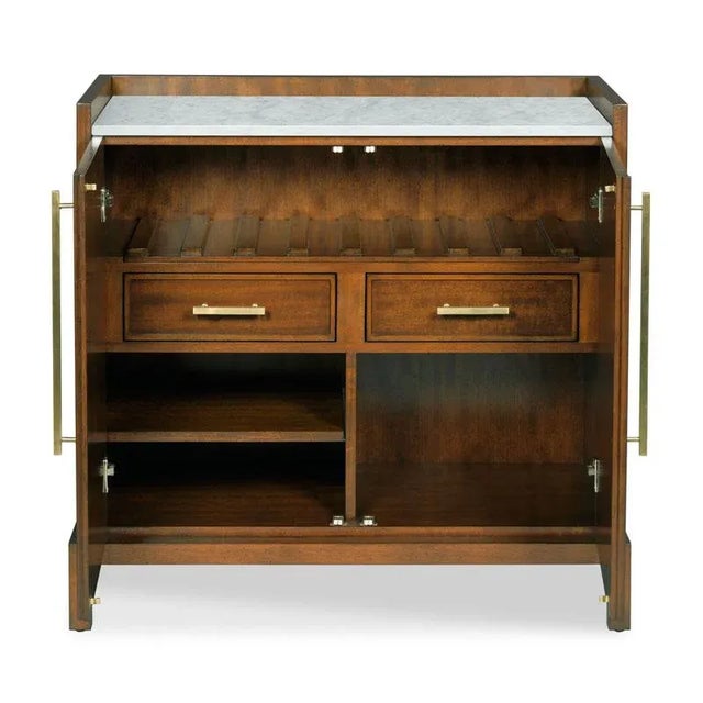 A wonderful multi use cabinet with modern styling that is softened by te use of carefully selected crotch mahogany for a...