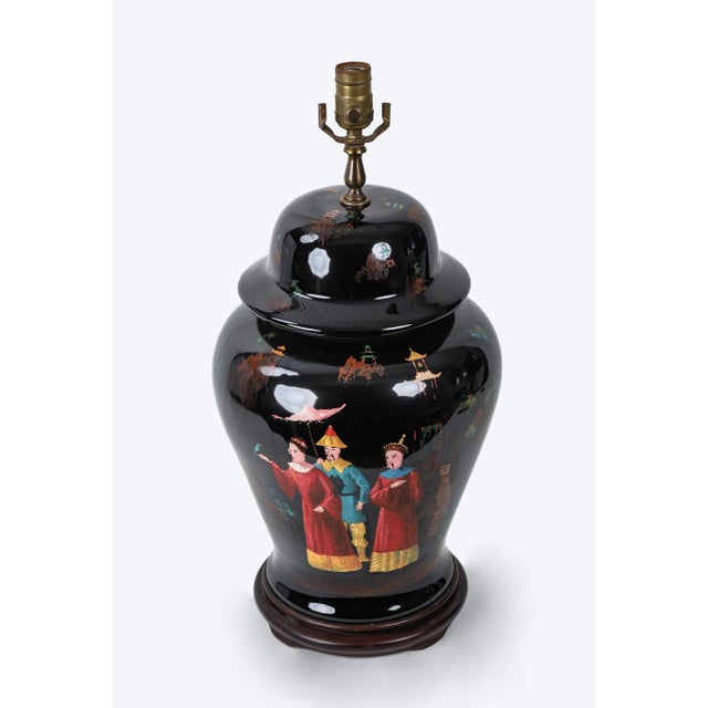 Hand-painted chinoiseries jar Table lamp. On a black background, the three people of the chinoiseries are hand-painted and...