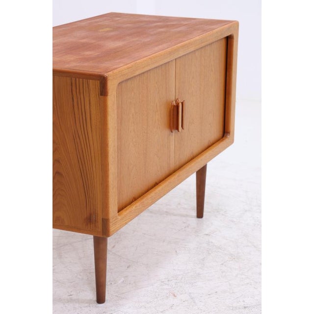 Vintage chest of drawers by Dyrlund with a clean, compact design and finely crafted wooden handles. Behind the two doors...