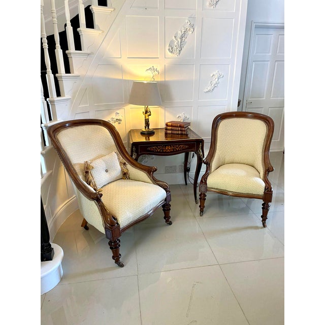 Unusual pair of antique Victorian quality mahogany armchairs having a quality shaped mahogany back, scroll shaped arms,...