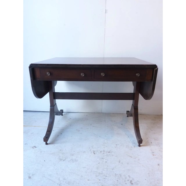 Circa 1970 federal style sofa table with 2 drop leaves on ends. 2 drawers in front. In great condition with few...