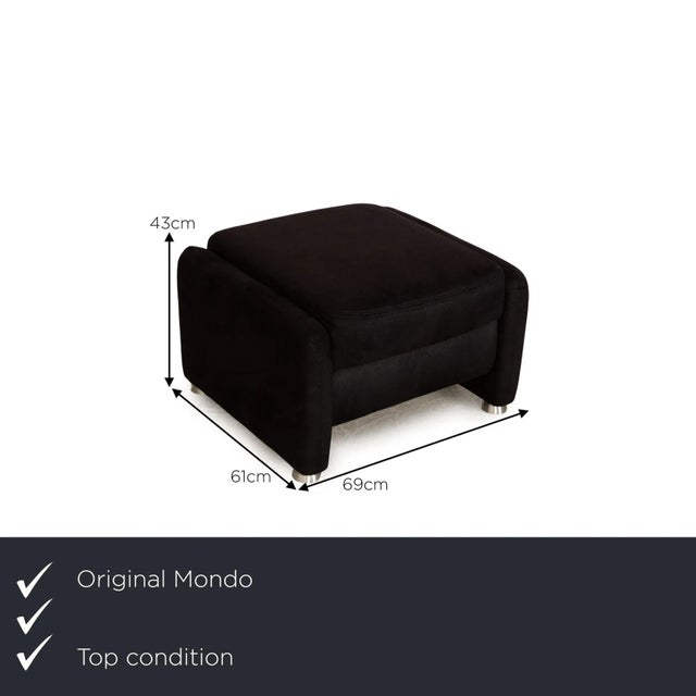 The Recita stool from Mondo is covered in a dark blue fabric and stands on floor-to-ceiling side panels. The minimalist...