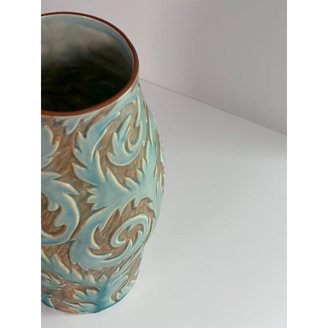 An original Art Deco ceramic vase by Thomas Forester & Sons, crafted in Staffordshire, England during the early 1930s....