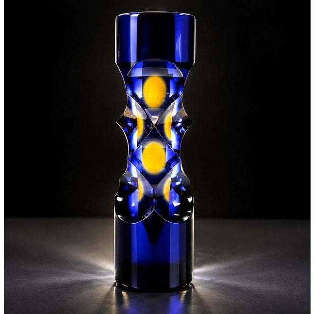 A striking and extremely heavy Czech studio art glass vase by Milan Macháček for Princ Glass, featuring a dark cobalt blue...