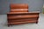 Solid Cherry king sleigh bed by Martin’s Furniture, featuring a classic rolled headboard and footboard with rich, warm...