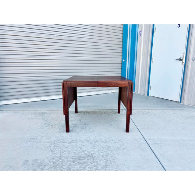 ✨ Vintage Danish Modern in Luxe Rosewood ✨ This 1970s Danish Extendable Dining Table is a striking showcase of mid-century...
