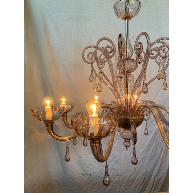 Beautiful chandelier with only one color: light purple transparent. Handmade by Toso glass master of the company in the...