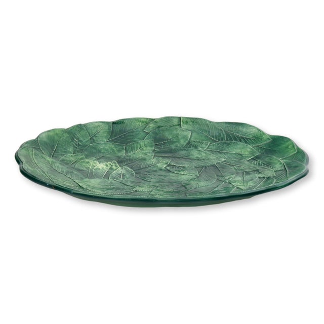 Italian ceramic serving platter by Ceramiche Leonardo, featuring an intricate relief of overlapping leaves finished in...