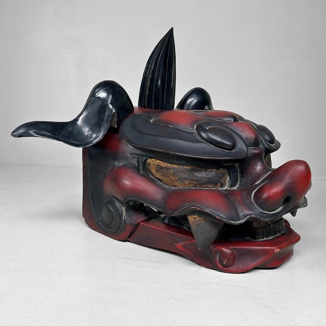 An impressive and rare wooden shishi mask (mythical lion), traditionally used in Japanese lion dances (shishimai) to ward...