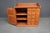 Bench-made solid cherry apothecary cabinet with a distinctive raised tray top featuring shaped gallery sides and curled...