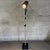 A lighting fixture with a distinctly industrial and metropolitan feel, attributed to manufacturing in the second half of...