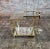Vintage Three-Tier Art Deco Style Brass Service/Bar Cart Stylish bar cart with convex bowed legs, the top two tiers have a...