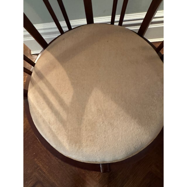 An elegant Hepplewhite-style barrel back accent chair crafted in richly toned mahogany, showcasing refined neoclassical...