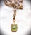 Luxurious Vintage etched four photo gold locket with a high-pronged faceted pacific opal stone. This beautiful brass...