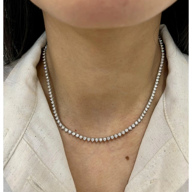 This stunning 5.41 ct diamond tennis necklace has 130 diamonds mounted on 18k white gold. The diamonds boast a color of...