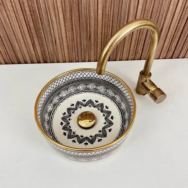 Our Gold Ceramic Sink is stunning addition to elevate your bathroom decor. Handcrafted with meticulous attention to...