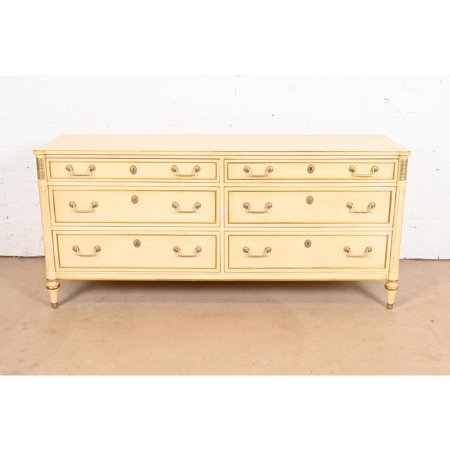 A gorgeous French Regency Louis XVI style six-drawer dresser or chest of drawers By Kindel Furniture USA, Circa 1960s...