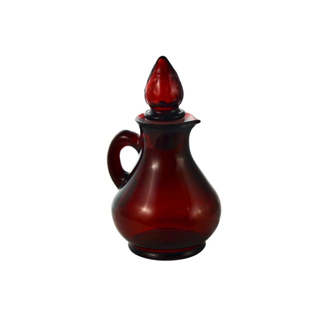 Vintage deep ruby red glass cruet petite pitcher with a conical tip glass stopper and tight fit rubber plastic gasket....