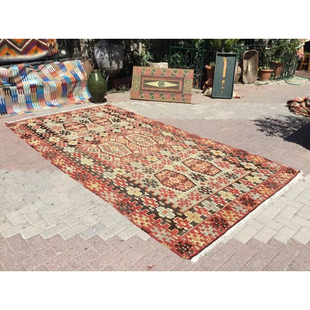 This beautiful, vintage, handwoven kilim is approximately 70 years old. It is handmade, of very fine quality hand spun...