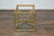 An Italian Midcentury gilt metal cocktail table with glass top and star shaped cross stretcher. This Italian Midcentury...