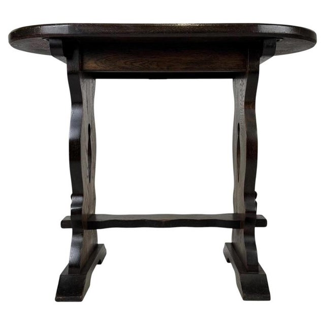 A handsome 20th-century English side table by KB Contracts of London, finely crafted from oak and distinguished by its...