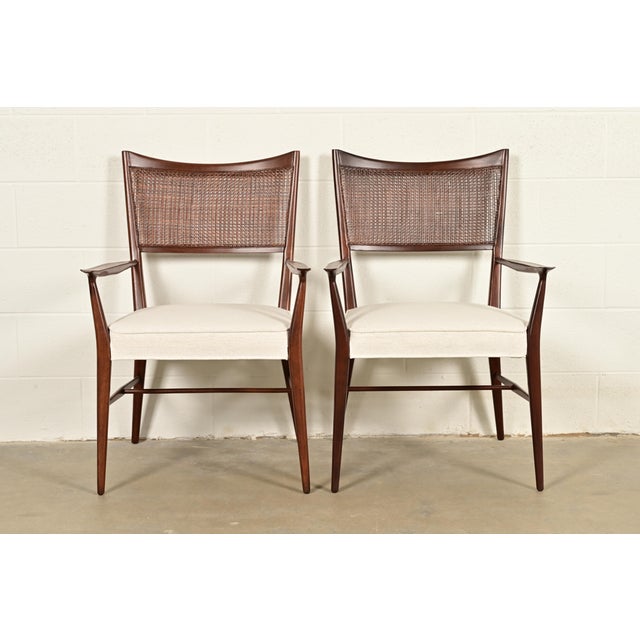 A gorgeous pair of Mid-Century Modern armchairs or dining captain chairs By Paul McCobb for Directional and produced by...