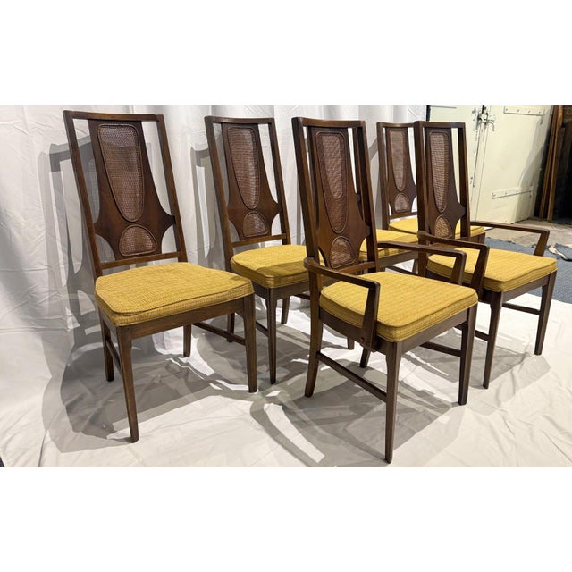 A rare set of six vintage walnut dining chairs, crafted by Broyhill for the iconic Brasilia collection, circa early 1960s....