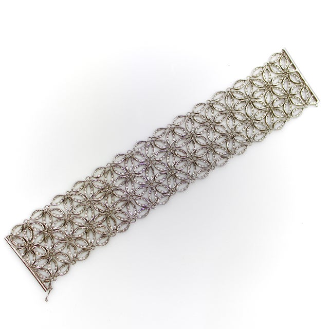 This exceptionally crafted 14k white gold Italian-made mesh bracelet is a prime example of high-end Italian goldsmithing....