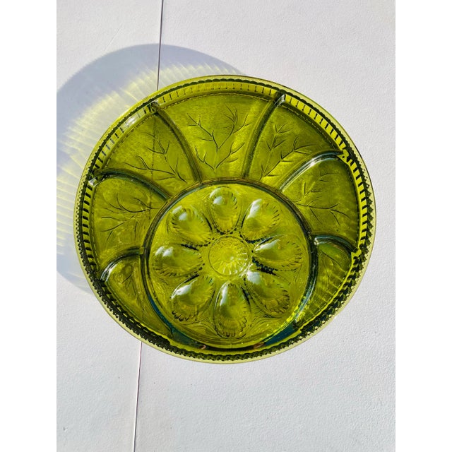 Beautiful deep green vintage mid century modern deviled egg and relish serving platter. The platter features a circular...