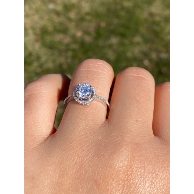 The Champ: Halo Set Natural Diamond Engagement Ring in White Gold. This exquisite ring exudes luxury and elegance,...