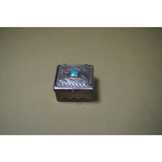 Tiny silver and turquoise box. Measures 1 3/4" x 1 3/4" x 1 1/2" high.