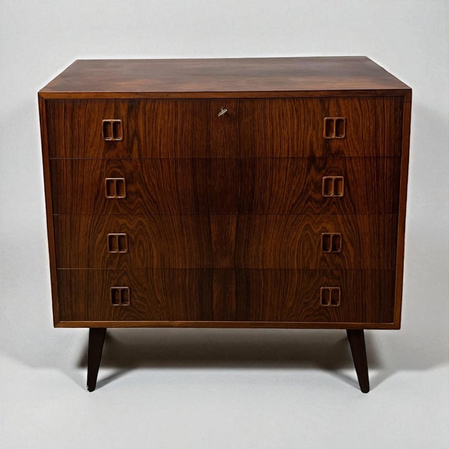 Elegant chest of drawers in rosewood, attributed to Danish designer Niels J. Thorsø, c. 1960s. Features include...