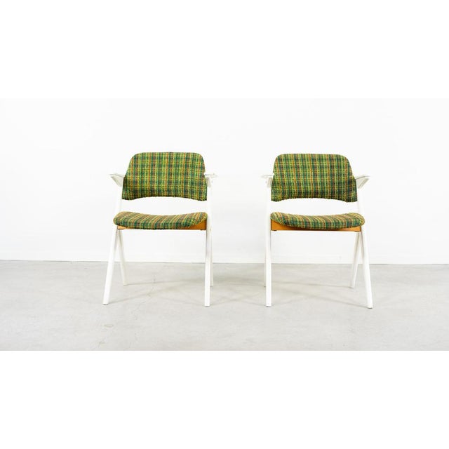 Painted beech frame “Trivia” armchairs designed by Bengt Ruda and made by Nordiska Kompaniet. Marked with Nordiska...