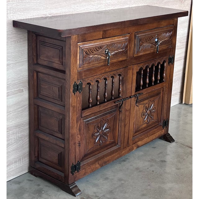 From Northern Spain, constructed of solid oak, the rectangular top with molded edge atop a conforming case housing two...