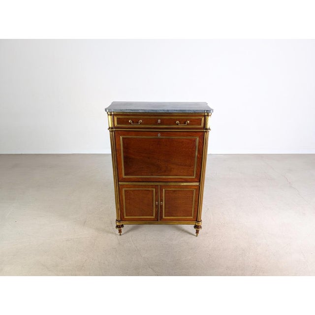 Beautiful louis xvi mahogany secretary desk. The piece features a very well-preserved, fold-down interior/work area with a...