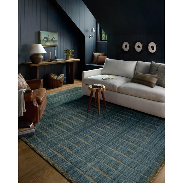 The Calvin Collection by Chris Loves Julia x Loloi is a geometric area rug with tile-inspired patterns for contemporary...