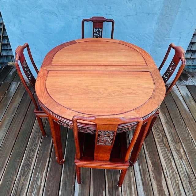 Solid Rosewood Ming design Table and Comfortable Chairs. The set includes a beautifully designed table and four...