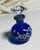 Cobalt blue round crystal perfume bottle white enamel painted flowers with gold rim & faceted crystal stopper