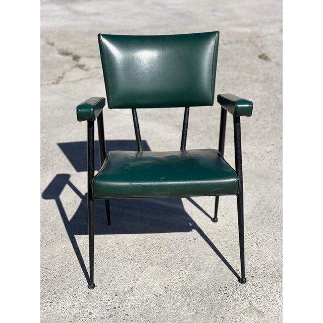 Colette Gueden armchair in green faux leather with black stitching. Tubular steel frame, re-lacquered black, and...