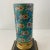 A beautiful late-19th-century French Longwy enameled oil lamp base, richly decorated in the vivid floral palette and...