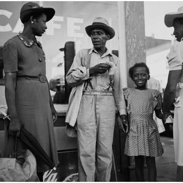 Family in Mississippi A family standing outside a café in Franklin Street, Natchez, Adams County, Mississippi, circa 1960....