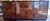 1980's signed burlwood Henredon scene three credenza is in near fine condition. It measures 30" h x 68" a x 18" d. Be sure...