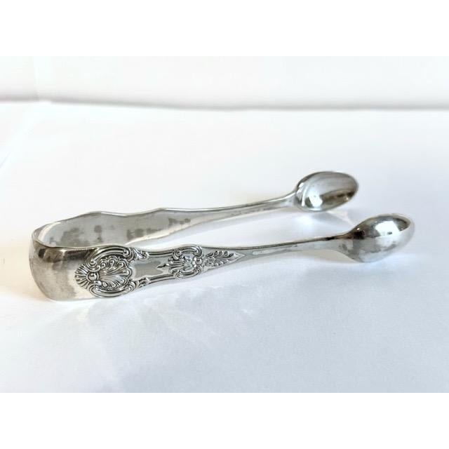 This item is sourced in Scotland. This sugar tong is silver plate and can be used to pick up sugar cubes but can also be...