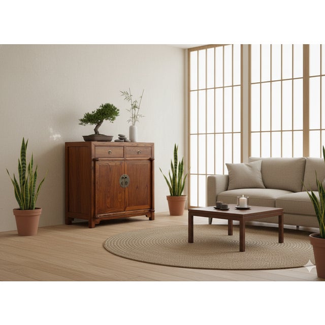 This elegant Chinese-style sideboard, crafted from a rich, honey-toned hardwood with a prominent swirling grain, balances...