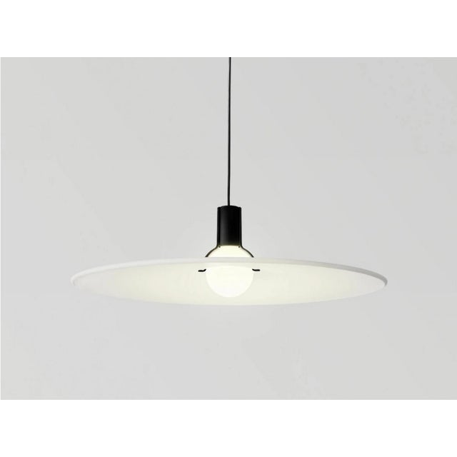 Pendant lamp model 2133 designed by gino sarfatti for arteluce (1972). A quest for simplicity: a grooved disc in white...