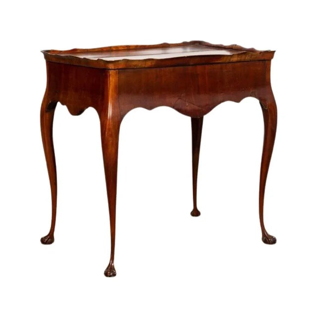 Georgian fruitwood tea table, having chestnut secondary wood, scalloped tray top, one-drawer, scalloped apron; and rising...