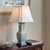 Offering a stunning Chinoiserie style celadon porcelain table lamp from the early-20th century. This beautiful vase-form...