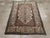 An antique Indian Agra accent rug. The decoration both of the ivory subfield and the matching ivory border of a twisted,...