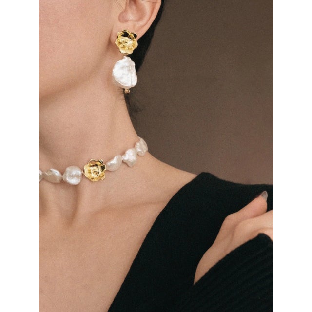 The Pearlescent Flowers Earrings are Handmade with Freshwater Pearls, 18K Gold Plated Brass with e-coating, and 12K Gold...